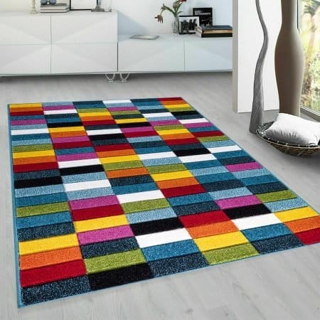 Multi Color Rug with geometric and flowing shape patterns including Box, Circles, Geo Play and Splash designs, available in sizes from 60 x 110 cm to 200 x 290 cm, styled in a modern UK living room