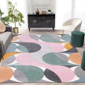 Kenzo Rugs shown in Beige, Blue, Emerald, Grey, Multi Colour, Navy, Ochre, Pink and Red across UK interiors including a hallway runner, a medium bedroom and a spacious living room, illustrating the collection's five sizes from 66×220 cm to 200×290 cm.